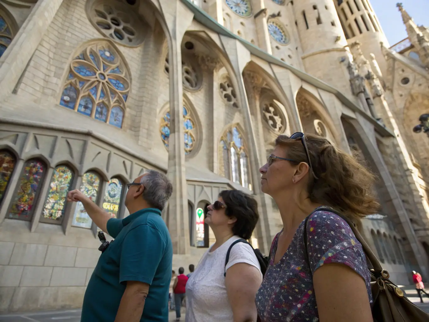 A photograph showing a group of students on a guided tour of the basilica, with a knowledgeable guide explaining the historical and artistic significance of the various artworks.